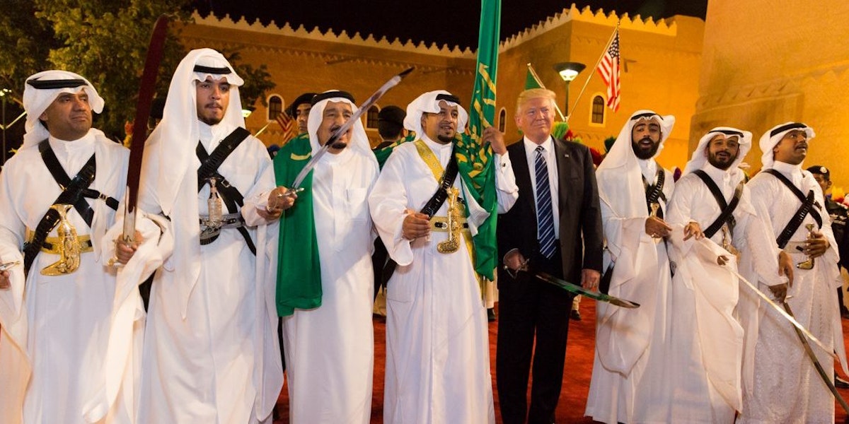 President Donald Trump poses for photos with ceremonial swordsmen on his arrival to Murabba Palace, as the guest of King Salman bin Abdulaziz Al Saud of Saudi Arabia, Saturday evening, May 20, 2017, in Riyadh, Saudi Arabia. (Official White House Photo by Shealah Craighead)