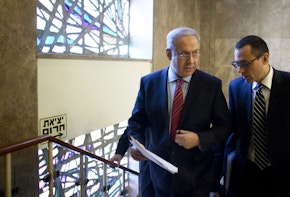 JERUSALEM, ISRAEL - NOVEMBER 14:  (ISRAEL OUT) Israeli Prime Minister Benjamin Netanyahu (L) walks up stairs to his Jerusalem offices for the weekly cabinet meeting on November 14, 2010 in Jerusalem, Israel. Netanyahu will encourage his cabinet to cease construction in the West Bank and will negotiate receiving three billion dollars worth in security incentives in return for signing a peace agreement with the Palestinians.  (Photo by Uriel Sinai/Getty Images)