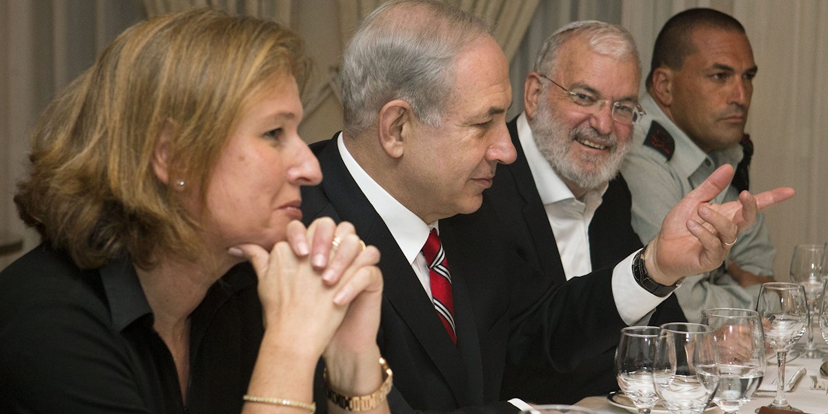 Tzipi Livni, Israel's chief negotiator with the Palestinians (L) sits next to Israel's Prime Minister Benjamin Netanyahu, with Yaakov Amidror, National Security Advisor to the Prime Minister, and Military Secretary Major General Eyal Zamir, as Netanyahu meets with U.S. Secretary of State John Kerry (unseen) in Jerusalem on June 29, 2013. Kerry kept up his frenetic Mideast diplomacy shuttling again between Palestinian and Israeli leaders in hopes of restarting peace talks.AFP PHOTO/JACQUELYN MARTIN-POOL (Photo credit should read JACQUELYN MARTIN/AFP/Getty Images)