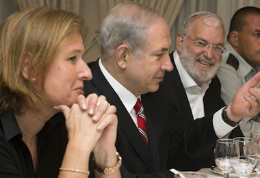 Tzipi Livni, Israel's chief negotiator with the Palestinians (L) sits next to Israel's Prime Minister Benjamin Netanyahu, with Yaakov Amidror, National Security Advisor to the Prime Minister, and Military Secretary Major General Eyal Zamir, as Netanyahu meets with U.S. Secretary of State John Kerry (unseen) in Jerusalem on June 29, 2013. Kerry kept up his frenetic Mideast diplomacy shuttling again between Palestinian and Israeli leaders in hopes of restarting peace talks.AFP PHOTO/JACQUELYN MARTIN-POOL        (Photo credit should read JACQUELYN MARTIN/AFP/Getty Images)