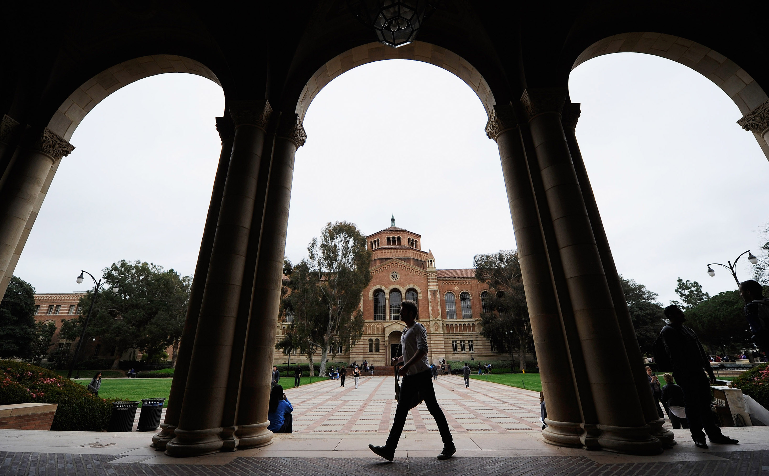 LOS ANGELES, CA - APRIL 23:  A student walks near Royce Hall on the campus of UCLA on April 23, 2012 in Los Angeles, California. According to reports, half of recent college graduates with bachelor's degrees are finding themselves underemployed or jobless.  (Photo by Kevork Djansezian/Getty Images)