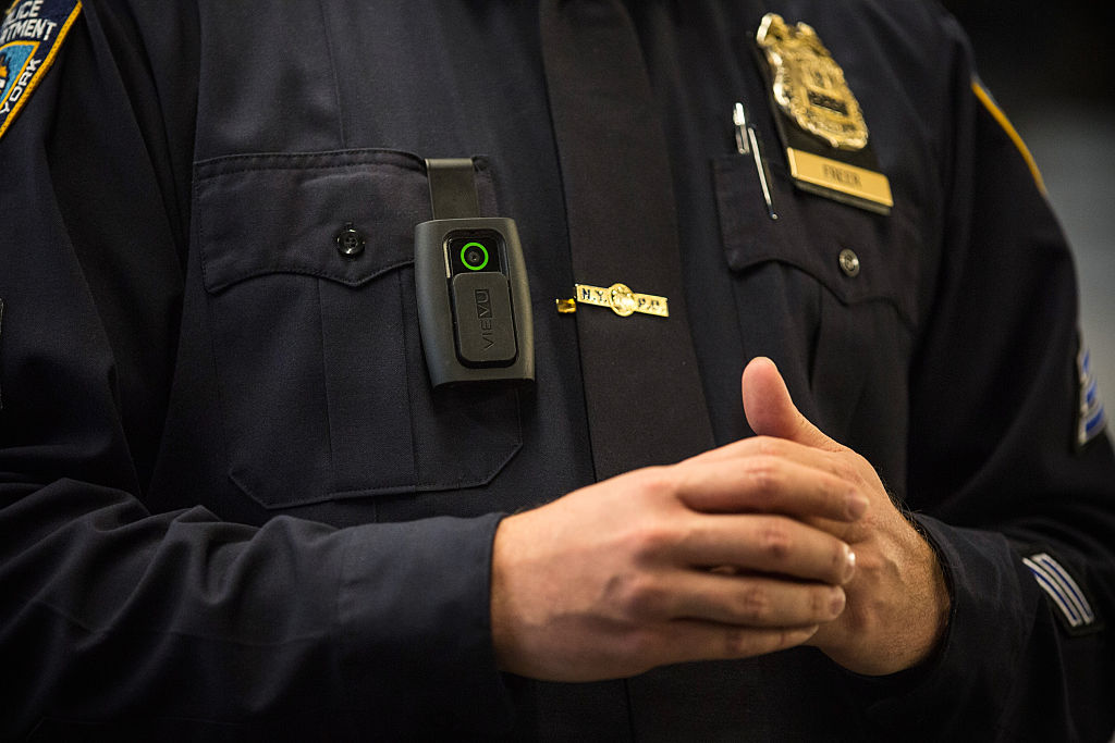 NEW YORK, NY - DECEMBER 03:  New York Police Department (NYPD) Sergeant Joseph Freer demonstrates how to use and operate a body camera during a media press conference on December 3, 2014 in New York City. The NYPD is beginning a trial exploring the use of body cameras; starting Friday NYPD officers in three different precincts will begin wearing body cameras during their patrols.  (Photo by Andrew Burton/Getty Images)