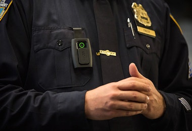 NEW YORK, NY - DECEMBER 03: New York Police Department (NYPD) Sergeant Joseph Freer demonstrates how to use and operate a body camera during a media press conference on December 3, 2014 in New York City. The NYPD is beginning a trial exploring the use of body cameras; starting Friday NYPD officers in three different precincts will begin wearing body cameras during their patrols. (Photo by Andrew Burton/Getty Images)