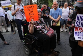 NEW YORK, NY - JUNE 28:  Jean Ryan from Disabled in Action joins others in protesting against the Senate healthcare bill on June 28, 2017 in New York City. The vote on the bill, which would make drastic cuts in medicaid among other changes, was postponed on Tuesday as Republican leadership seek to persuade fellow Republicans to vote for the plan. Currently, nine senators have said they will not support the bill, and the party can only afford to lose two for it to pass.  (Photo by Spencer Platt/Getty Images)