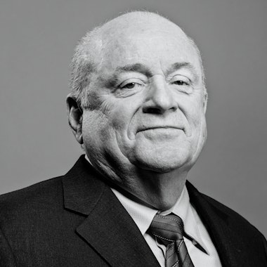 a black and white photo of a man in a suit and tie