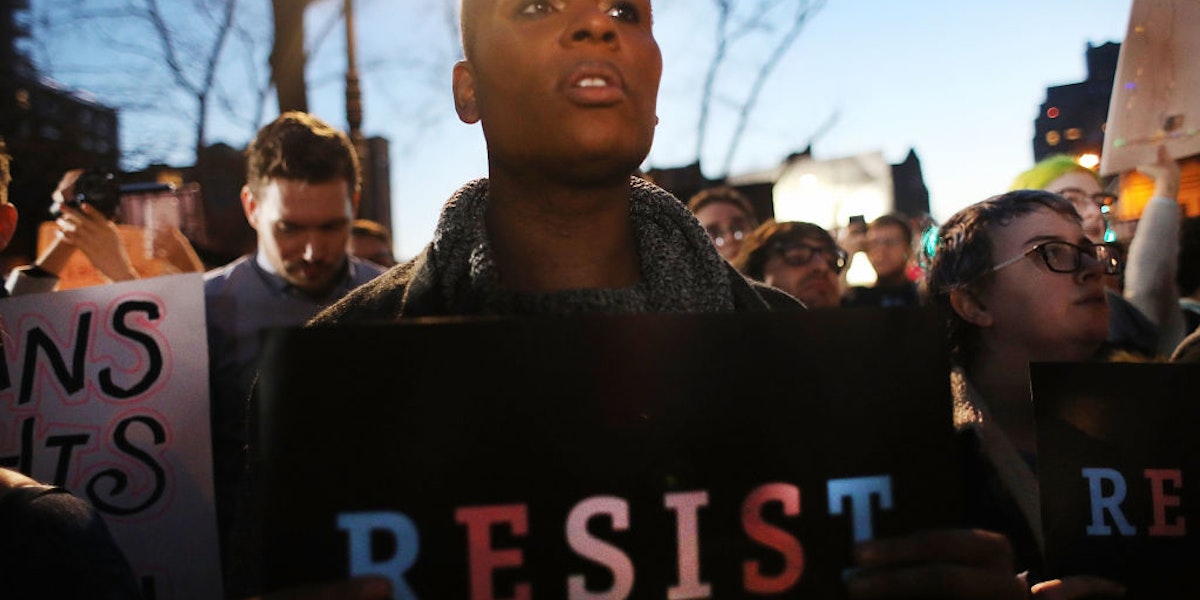 NEW YORK, NY - FEBRUARY 23:  Hundreds protest a Trump administration announcement this week that rescinds an Obama-era order allowing transgender students to use school bathrooms matching their gender identities, at the Stonewall Inn on February 23, 2017 in New York City. Activists and members of the transgender community gathered outside the historic LGTB bar to denounce the new policy.  (Photo by Spencer Platt/Getty Images)