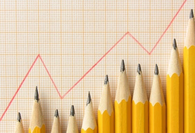 Aligned graphite pencils below red graph