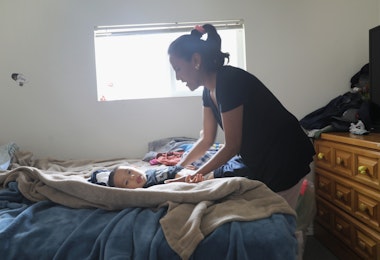 DENVER, CO - JUNE 06: Undocumented immigrant activist Jeanette Vizuerra changes her grandson's diaper on June 6, 2017 in Denver, Colorado. Vizguerra was given a temporary stay of deportation by ICE in May after taking sanctuary in Denver churches for three months. Vizguerra, who is from Mexico, has lived in the United States for twenty years and has three U.S.-born children. U.S. Immigration and Customs Enforcement (ICE), agents, emboldened by the leadership of President Donald Trump, have almost doubled arrests of undocumented immigrants, many of whom without criminal records, up from the previous year. The soaring number of detentions highlights a Trump campaign pledge to target the some 11 million people living as undocumented immigrants in the United States. (Photo by John Moore/Getty Images) (Photo by John Moore/Getty Images)