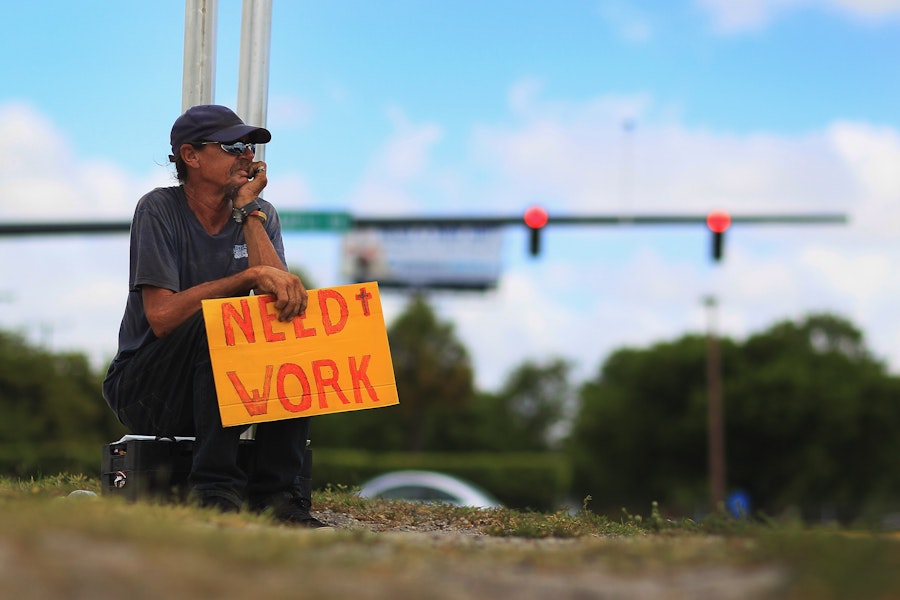 POMPANO BEACH, FL - JUNE 03:  Stephen Greene works a street corner hoping to land a job as a laborer or carpenter on June 3, 2011 in Pompano Beach, Florida.  Employers in May added 54,000 jobs the fewest in eight months, and the unemployment rate inched up to 9.1 percent.  (Photo by Joe Raedle/Getty Images)