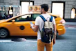Walking down the Manhattan using app for Taxi service