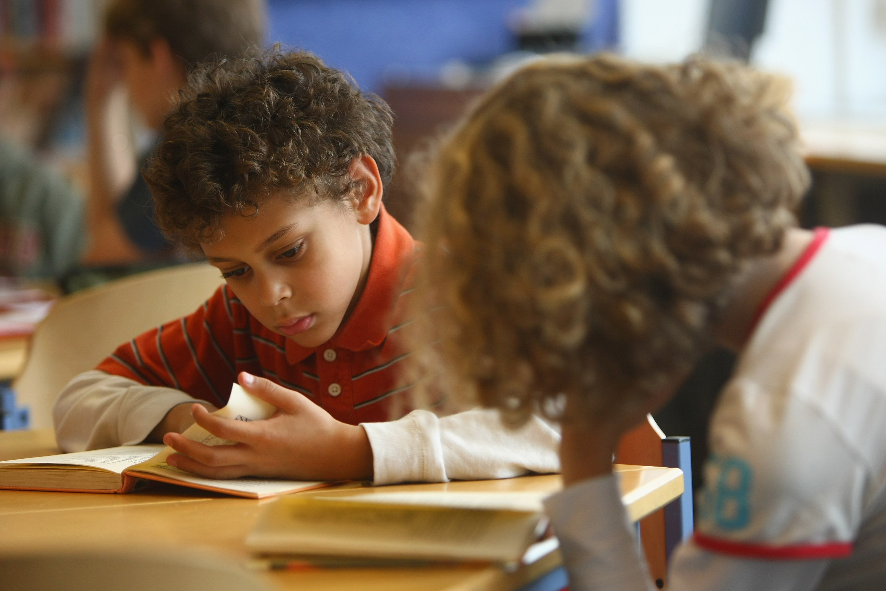 BERLIN - SEPTEMBER 18:  Fourth-grade students read books in the elementary school at the John F. Kennedy Schule dual-language public school on September 18, 2008 in Berlin, Germany. The German government will host a summit on education in Germany scheduled for mid-October in Dresden. Germany has consistantly fallen behind in recent years in comparison to other European countries in the Pisa education surveys, and Education Minister Annette Schavan is pushing for an 8 percent increase in the national educaiton budget for 2009.  (Photo by Sean Gallup/Getty Images)