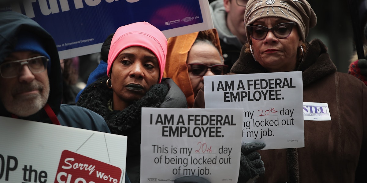 CHICAGO, ILLINOIS - JANUARY 10: Government workers protest the government shutdown during a demonstration in the Federal Building Plaza on January 10, 2019 in Chicago, Illinois. The protest, on the 20th day of a partial shutdown, was one of several held around the country today.  (Photo by Scott Olson/Getty Images)