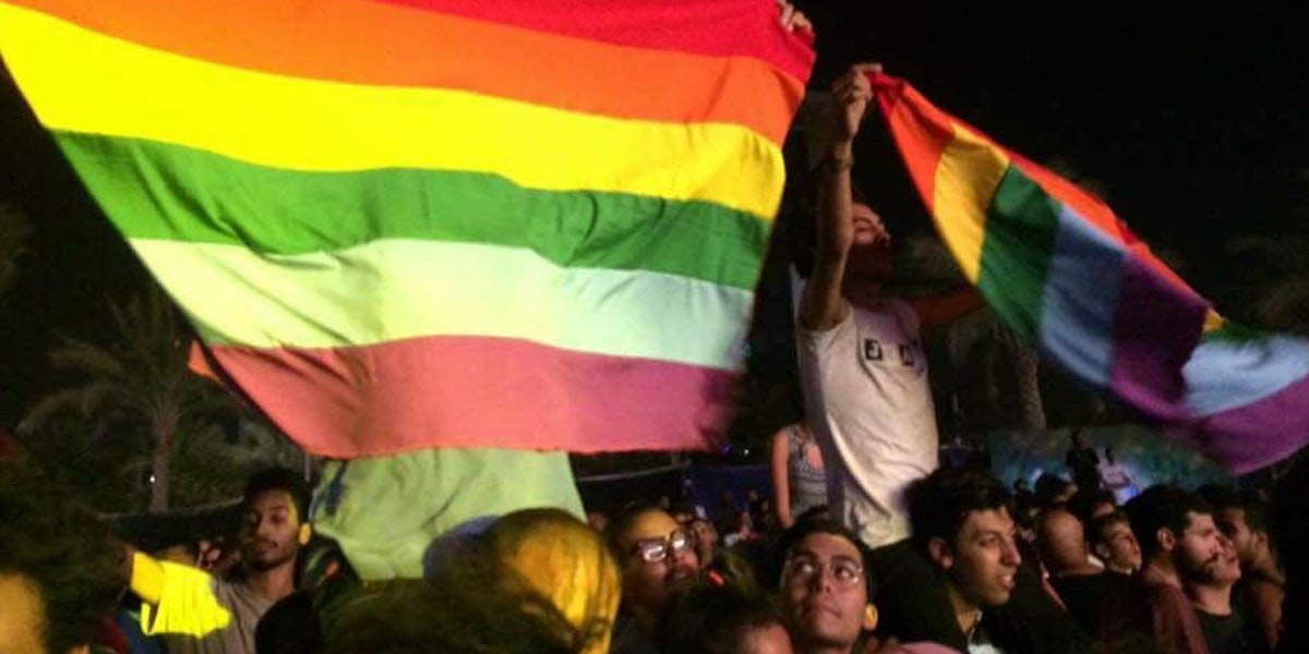 Fans of the Lebanese group Mashrou Leila show a a rainbow flag at the concert in Cairo