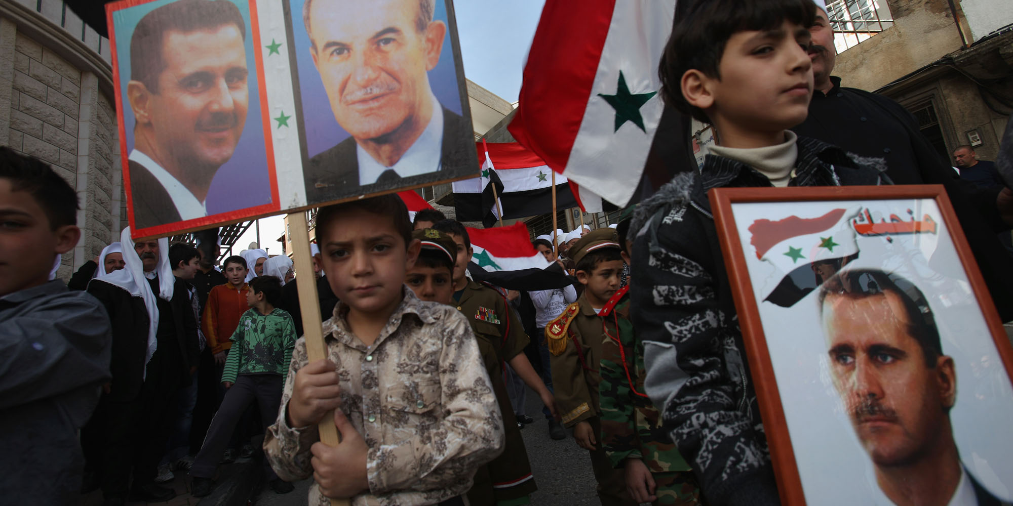 Druze men take part in a rally in the village of Majdel Shams, near the border between Israel