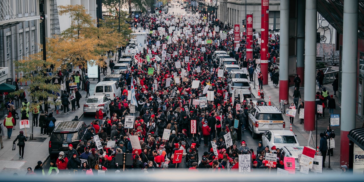 CHICAGO, IL - OCTOBER 23: Thousands of demonstrators take to the streets, stopping traffic and circling City Hall in a show support for the ongoing teachers strike on October 23, 2019 in Chicago, Illinois. Union teachers and school staff members are demanding more funding from the city in order to lower class sizes, hire more support staff, and build new affordable housing for the 16,000 Chicago Public Schools students whose families are homeless. (Photo by Scott Heins/Getty Images)