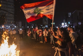 BEIRUT, LEBANON - NOVEMBER 03: A protester waves a Lebanese flag as anti-government demonstrators block the Chevrolet intersection on November 3, 2019 in Beirut, Lebanon. The country has seen 18 days of unrest after demonstrators took to the streets to protest tax hikes and government corruption. (Photo by Sam Tarling/Getty Images) (Photo by Getty Images/Getty Images)