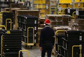 PETERBOROUGH, ENGLAND - NOVEMBER 27: (EDITORS NOTE: EMBARGOED TO 0001 ON THURSDAY NOVEMBER 28, 2019) A worker in the Peterborough Amazon Fulfilment Centre prepares for Black Friday on November 27, 2019 in Peterborough, England. The Amazon Black Friday sale runs from November 22-29, with thousands of deals on the latest consumer electronics and Amazon devices as well as this year's must-have toys, games, fashion, jewellery, beauty, home items and more. (Photo by Hollie Adams/Getty Images)