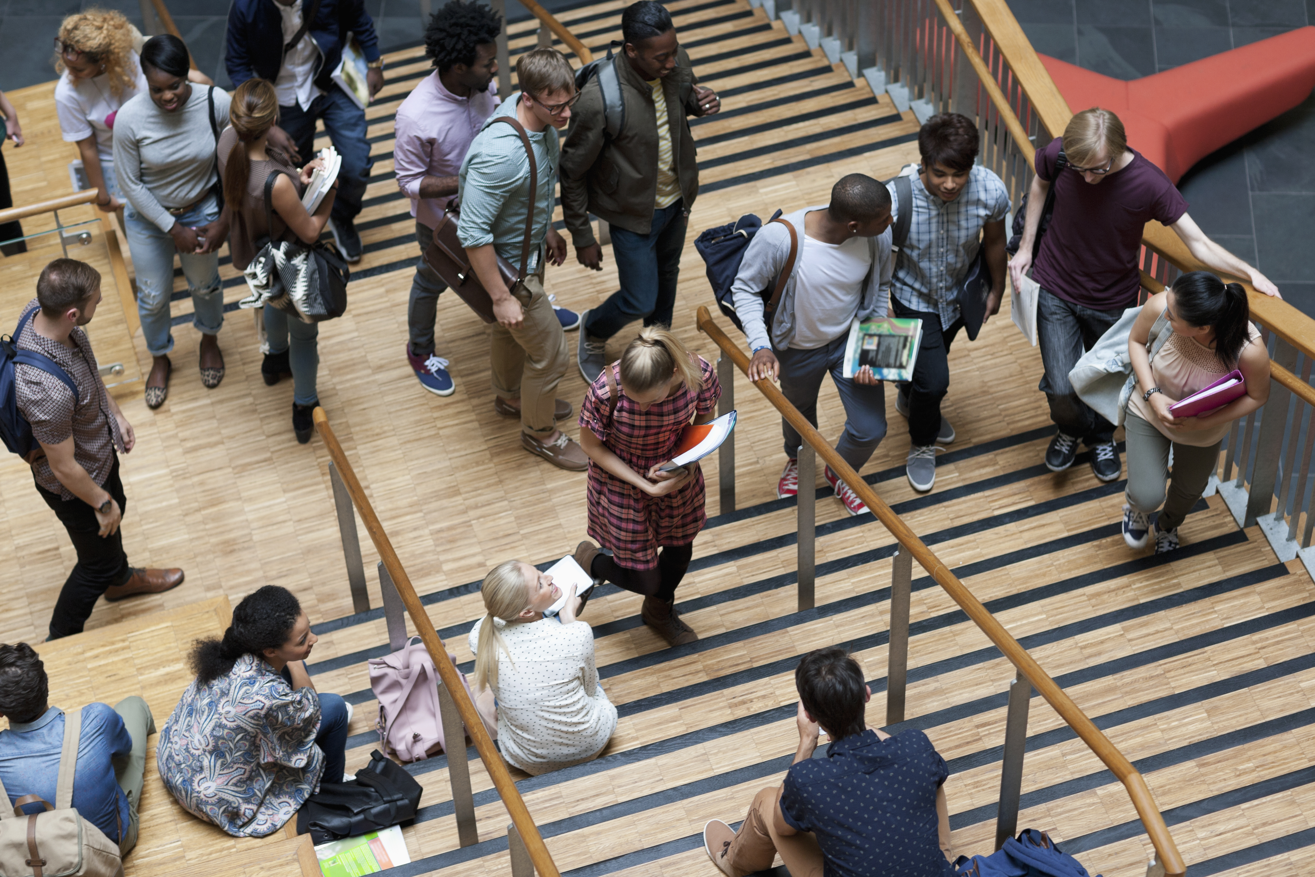 a group of people walking up and down stairs