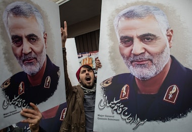 ISTANBUL, TURKEY - JANUARY 05: People hold posters showing the portrait of Iranian Revolutionary Guard Major General Qassem Soleimani and chant slogans during a protest outside the U.S. Consulate on January 05, 2020 in Istanbul, Turkey. Major General Qassem Soleimani, was killed by a U.S. drone strike outside the Baghdad Airport on January 3. Since the incident, tensions have risen across the Middle East.  (Photo by Chris McGrath/Getty Images)