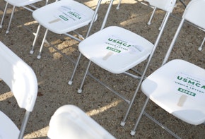 WASHINGTON, DC - SEPTEMBER 12: Paper signs of support are placed on audience members' chairs before a rally for the passage of the USMCA trade agreement, on September 12, 2019 in Washington, DC. Several agricultural groups including the American Farm Bureau Federation, the American Soybean Association and the National Corn Growers Association held the rally to urge Congress to ratify the trade deal. (Photo by Tom Brenner/Getty Images).
