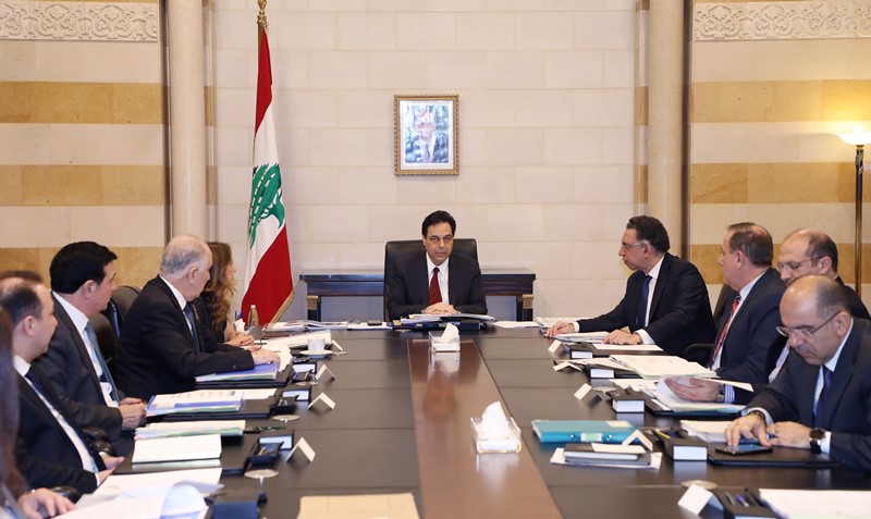 a group of people sitting around a table