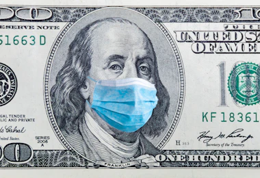 Coronavirus Wuhan. US quarantine, 100 dollar banknote with medical mask. The concept of epidemic and protection against coronavrius.