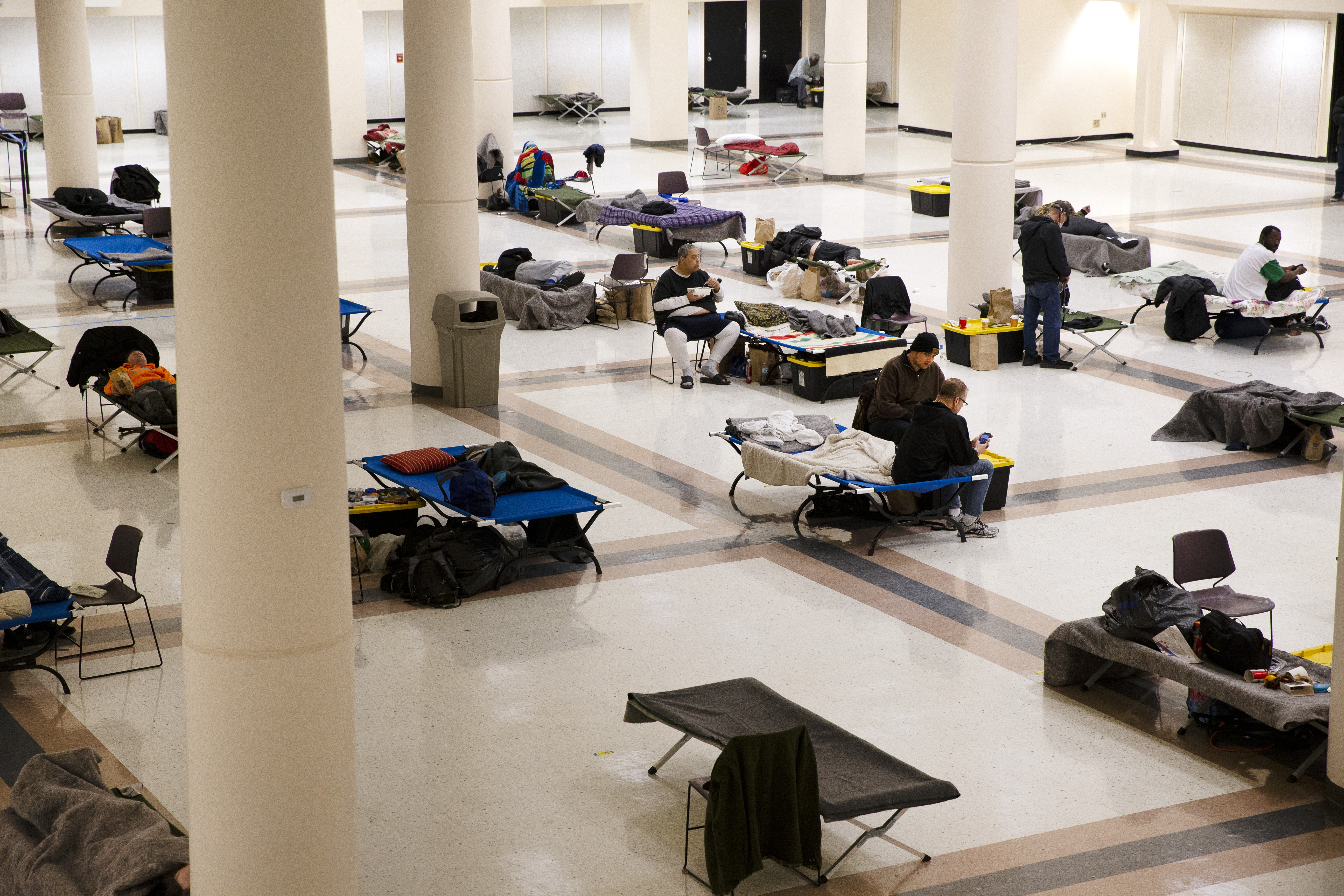 SEATTLE, WA - APRIL 06: The Exhibition Hall at the Seattle Center has been turned into a temporary men's shelter on April 6, 2020 in Seattle, Washington. The space currently has 150 beds, separated six feet apart, and operated by the Downtown Emergency Service Center (DESC). King County and the City of Seattle are working with higher capacity shelters to create more spaces and increase social distancing between individuals, which can help prevent the spread of COVID-19.  (Photo by Karen Ducey/Getty Images)