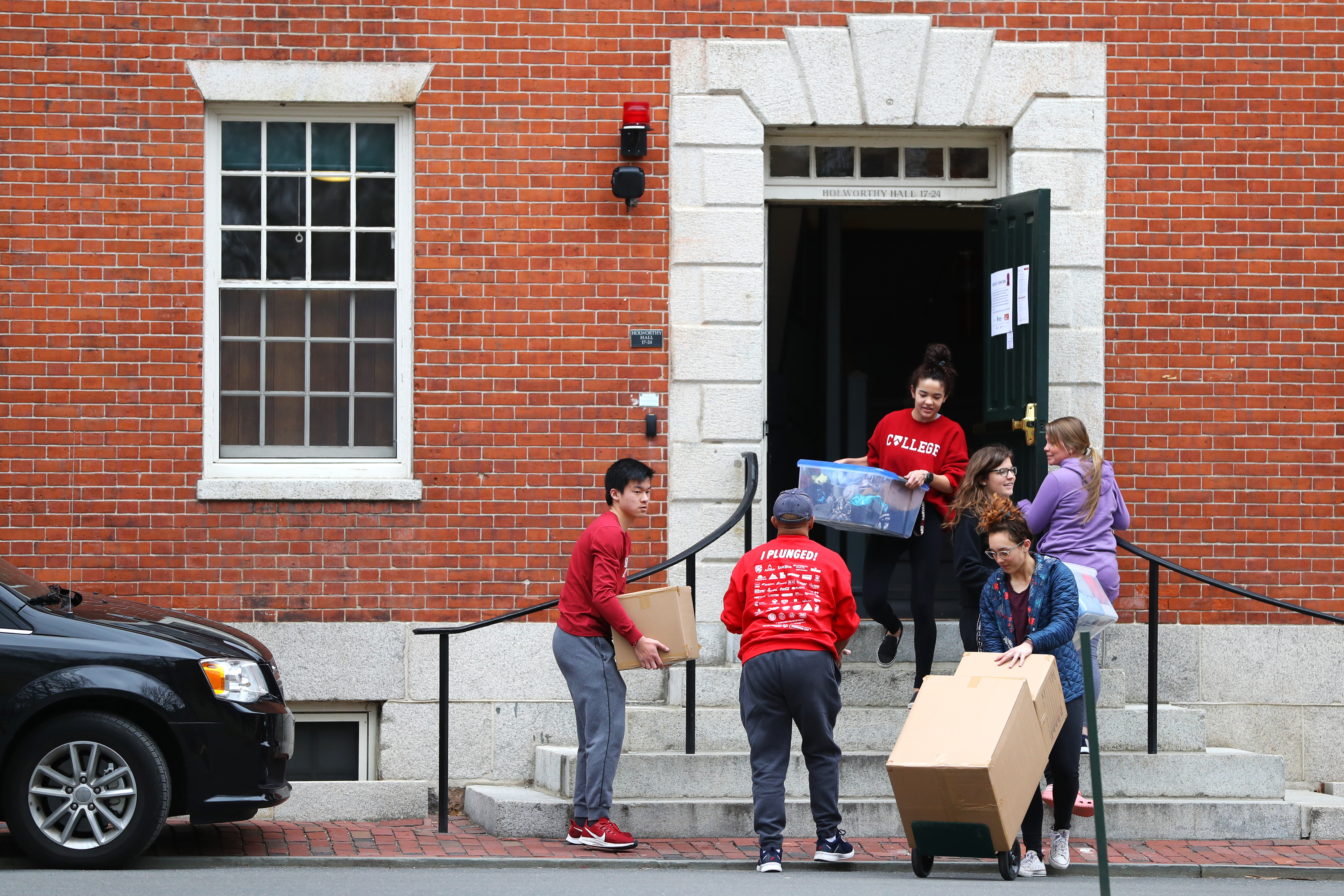 CAMBRIDGE, MASSACHUSETTS - MARCH 12: Students move out of dorm rooms on Harvard Yard on the campus of Harvard University on March 12, 2020 in Cambridge, Massachusetts. Students have been asked to move out of their dorms by March 15 due to the Coronavirus (COVID-19) risk. All classes will be moved online for the rest of the spring semester.  (Photo by Maddie Meyer/Getty Images)