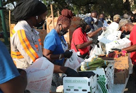 OPA LOCKA, FLORIDA - APRIL 14: City of Opa-locka employees and volunteers prepare bags of food, provided by the food bank Feeding South Florida, to be given out to the needy at a drive-thru distribution site on April 14, 2020 in Opa-locka, Florida. Feeding South Florida has seen a 600 percent increase in those asking for food aid as people, some of whom have lost jobs, need to make ends meet during the coronavirus pandemic.  (Photo by Joe Raedle/Getty Images)