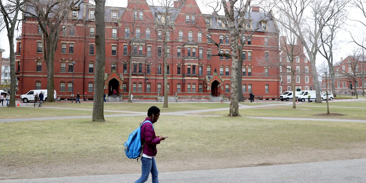 CAMBRIDGE, MASSACHUSETTS - MARCH 12: A student walks through Harvard Yard on the campus of Harvard University on March 12, 2020 in Cambridge, Massachusetts. Students have been asked to move out of their dorms by March 15 due to the Coronavirus (COVID-19) risk. All classes will be moved online for the rest of the spring semester.  (Photo by Maddie Meyer/Getty Images)
