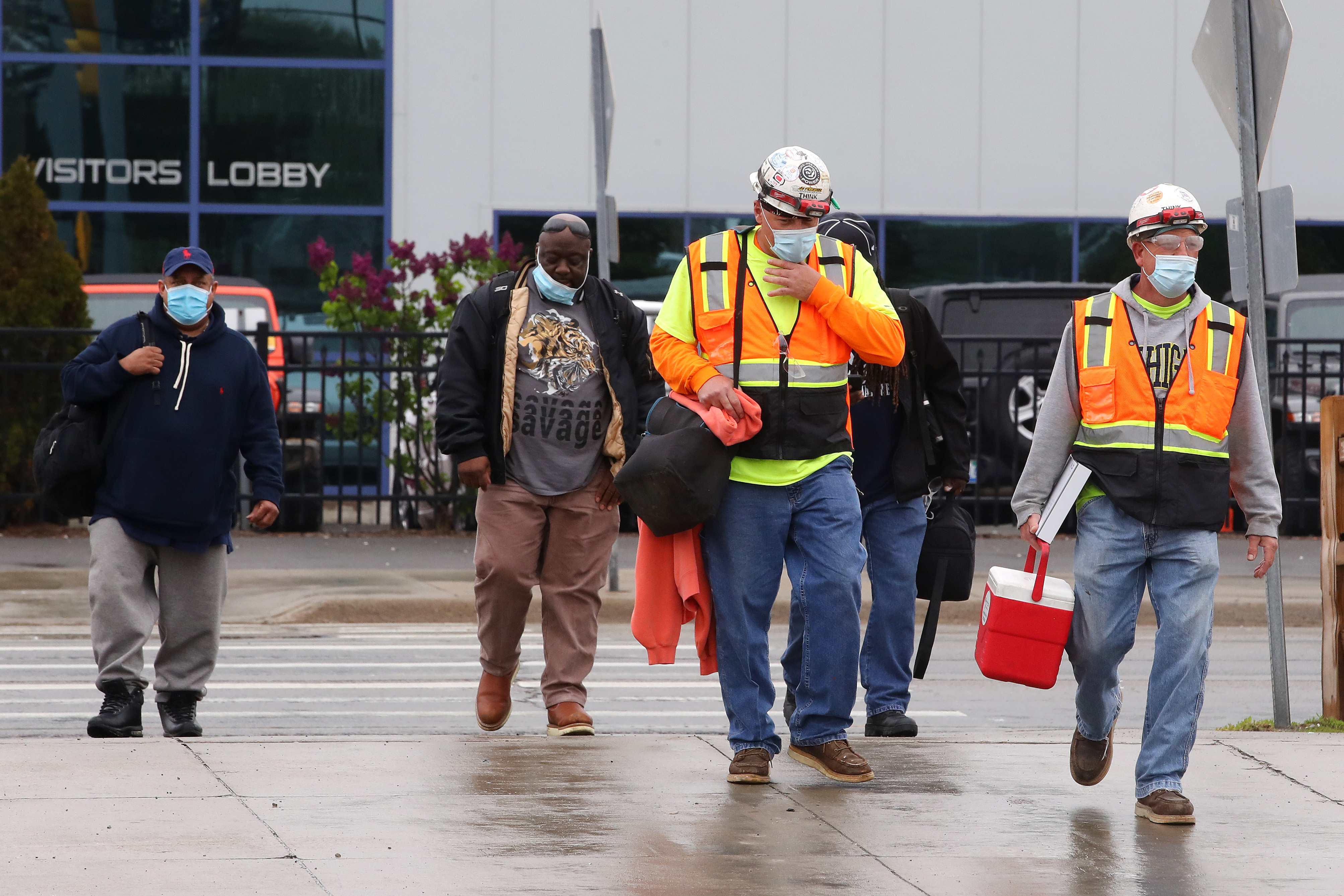 WARREN, MICHIGAN - MAY 18: United Auto Workers members leave the Fiat Chrysler Automobiles Warren Truck Plant after the first work shift on May 18, 2020 in Warren, Michigan. Fiat Chrysler along with rivals Ford and General Motors Co., restarted the assembly lines on Monday after several week of inactivity due to the COVID-19 pandemic. (Photo by Gregory Shamus/Getty Images)