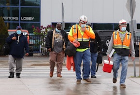 WARREN, MICHIGAN - MAY 18: United Auto Workers members leave the Fiat Chrysler Automobiles Warren Truck Plant after the first work shift on May 18, 2020 in Warren, Michigan. Fiat Chrysler along with rivals Ford and General Motors Co., restarted the assembly lines on Monday after several week of inactivity due to the COVID-19 pandemic. (Photo by Gregory Shamus/Getty Images)
