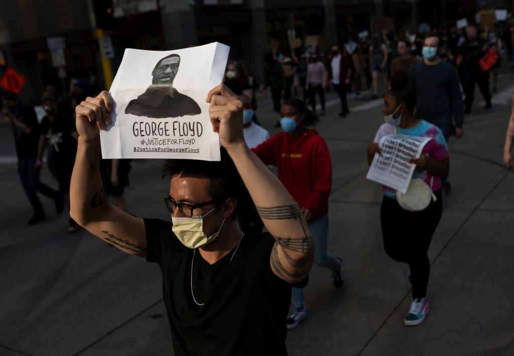 MINNEAPOLIS, MN - MAY 28: Protesters march through the street on May 28, 2020 in downtown Minneapolis, Minnesota. Police and protesters continued to clash for a third night after George Floyd was killed in police custody on Monday. (Photo by Stephen Maturen/Getty Images)