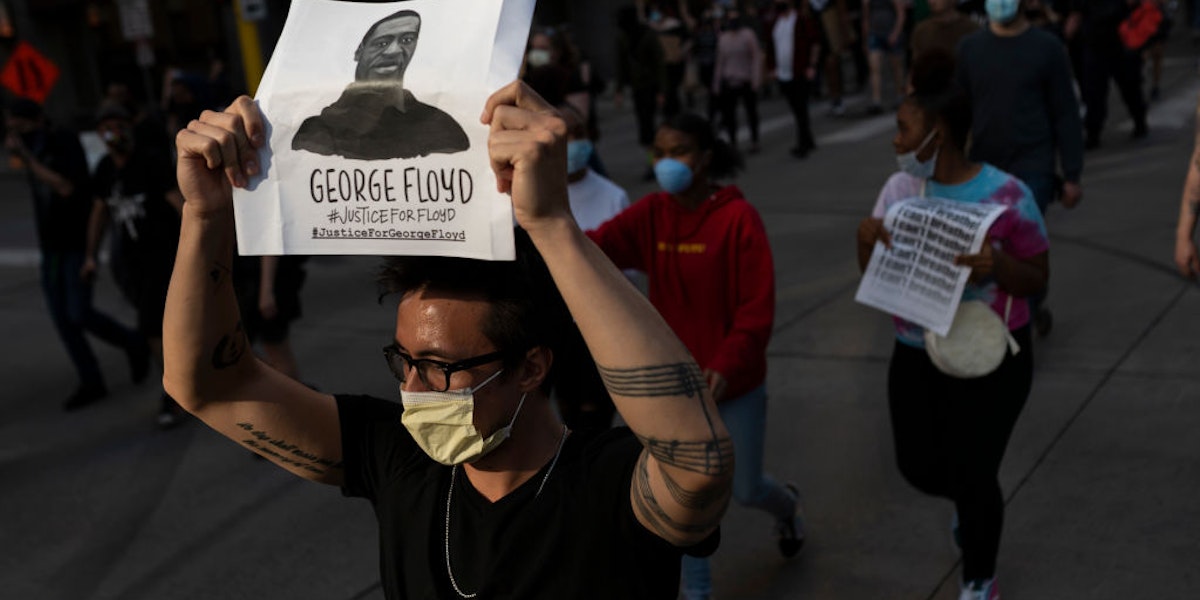 MINNEAPOLIS, MN - MAY 28: Protesters march through the street on May 28, 2020 in downtown Minneapolis, Minnesota. Police and protesters continued to clash for a third night after George Floyd was killed in police custody on Monday. (Photo by Stephen Maturen/Getty Images)