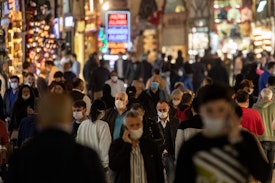 ISTANBUL, TURKEY - JUNE 01: People wearing protective face masks walk in the Grand Bazaar after it reopened after being shut down for weeks due to the spread of the coronavirus on June 01, 2020 in Istanbul, Turkey. As infection rates of the coronavirus continue to drop and after more than a month of weekend lockdowns, Turkey has begun reopening procedures, allowing bars, restaurants and cafes to open under new restrictions for the first time since March 17. Limited domestic flights have restarted and the stay-at-home curfew for citizens under 20 and over 65 has been eased.   (Photo by Chris McGrath/Getty Images)