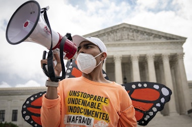 WASHINGTON, DC - JUNE 18: Roberto Martinez, a DACA recipient, chants and cheers following the Supreme Court's decision regarding the Trump administration's attempt to end DACA outside the U.S. Supreme Court on June 18, 2020 in Washington, DC. On Thursday morning, the Supreme Court, in a 5-4 decision, denied the Trump administration's attempt to end DACA, the Deferred Action for Childhood Arrivals program. (Photo by Drew Angerer/Getty Images)