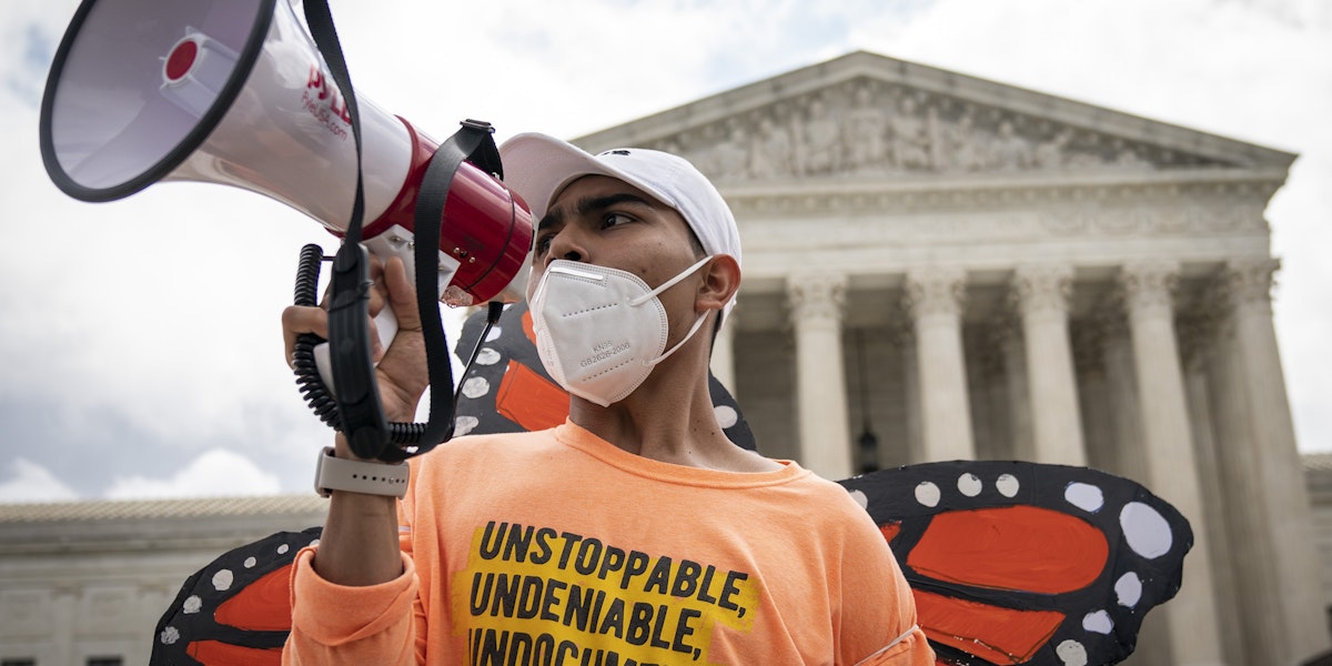 WASHINGTON, DC - JUNE 18: Roberto Martinez, a DACA recipient, chants and cheers following the Supreme Court's decision regarding the Trump administration's attempt to end DACA outside the U.S. Supreme Court on June 18, 2020 in Washington, DC. On Thursday morning, the Supreme Court, in a 5-4 decision, denied the Trump administration's attempt to end DACA, the Deferred Action for Childhood Arrivals program. (Photo by Drew Angerer/Getty Images)