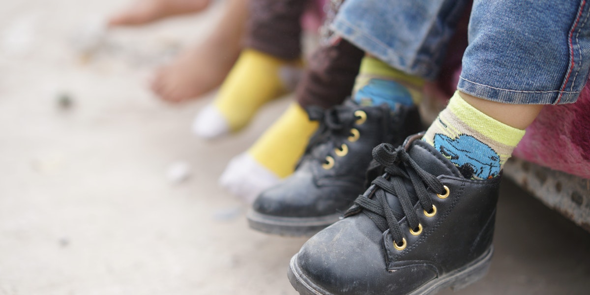 Children feet barefoot and with shoes