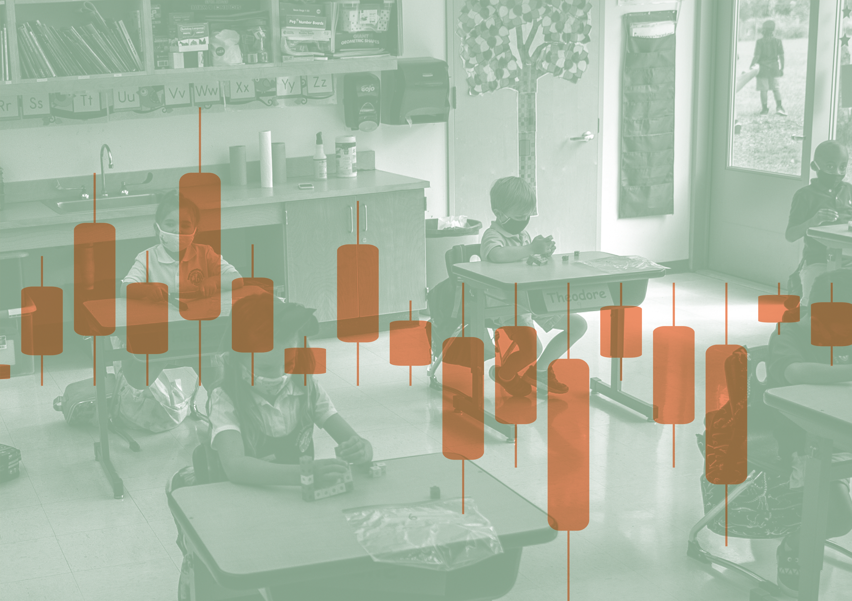 a group of children sitting at desks in a classroom