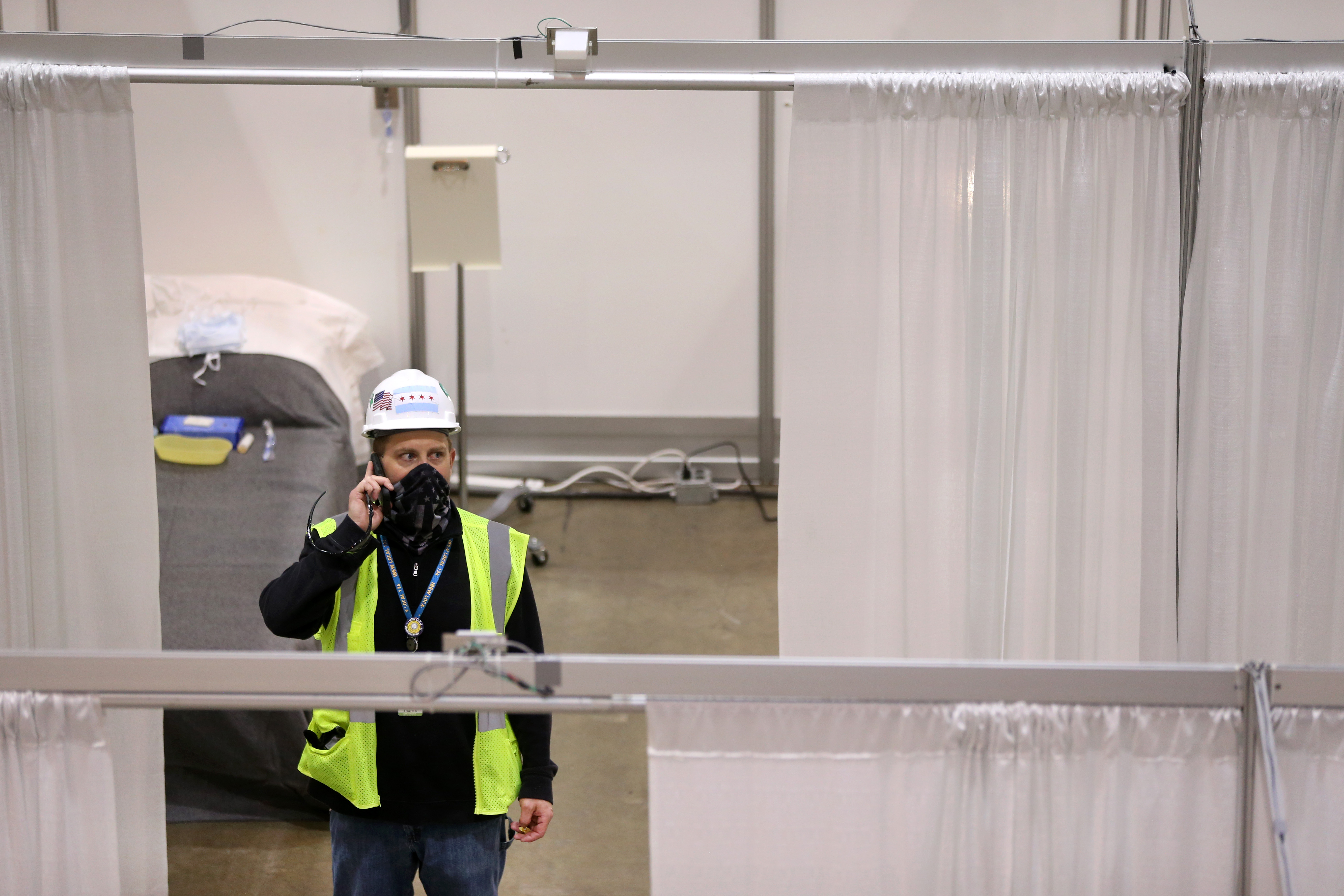 CHICAGO, IL - APRIL 3:  Construction workers put the finishing touches on Hall C Unit 1 of the COVID-19 alternate site at McCormick Place on Friday, April 3, 2020 in Chicago, Illinois. Gov. Pritzker And Mayor Lightfoot toured what will be a 3,000-bed medical facility to treat less seriously-ill COVID-19 patients built in a collaborative effort involving the Illinois National Guard, U.S. Army Corps of Engineers and trade unions.   (Photo by Chris Sweda-Pool via Getty Images)