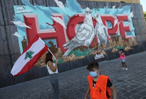 BEIRUT, LEBANON - OCTOBER 17: People walk past a 