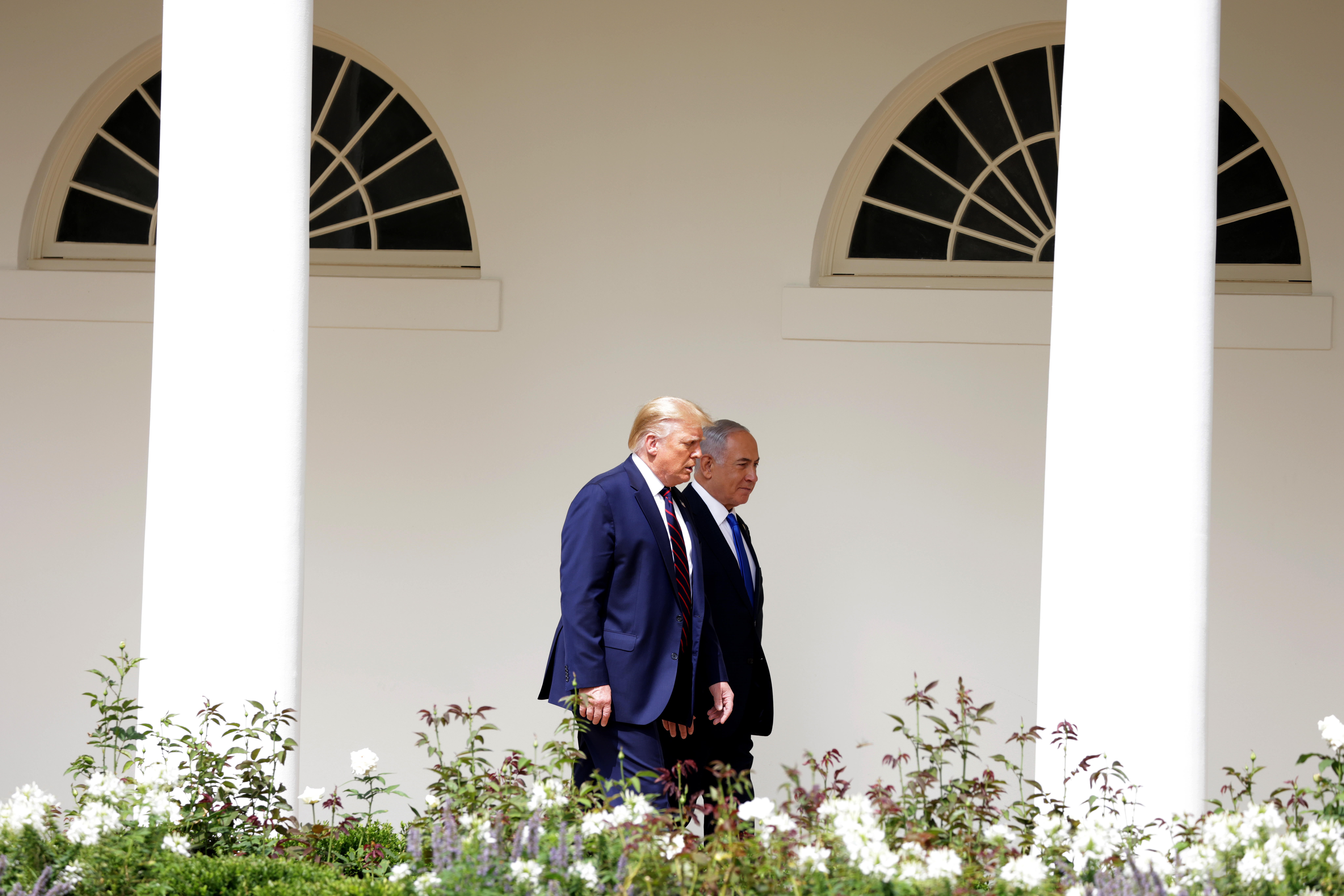 WASHINGTON, DC - SEPTEMBER 15:  Prime Minister of Israel Benjamin Netanyahu and U.S. President Donald Trump walk through the West Wing Colonnade prior to the signing ceremony of the Abraham Accords on the South Lawn of the White House on September 15, 2020 in Washington, DC. Witnessed by President Trump, Prime Minister Netanyahu signed a peace deal with the UAE and a declaration of intent to make peace with Bahrain. (Photo by Alex Wong/Getty Images)