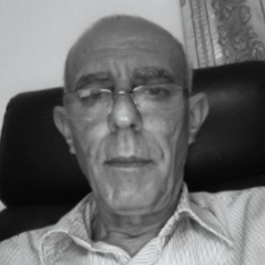 a black and white photo of a man with glasses