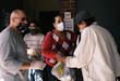 NEW YORK, NEW YORK - OCTOBER 17: People receive food at the Thessalonica Christian Church during a distribution site on October 17, 2020 in New York City. The Bronx, a borough which has long struggled with poverty and neglect, has been especially impacted by the COVID-19 pandemic. The official unemployment rate in the Bronx is 21% while the unofficial number is presumed to be almost twice that. With many residents unable to afford health care and being home to a significant amount of front-line workers, the Bronx has the highest COVID-19 death rate in New York City. (Photo by Spencer Platt/Getty Images)