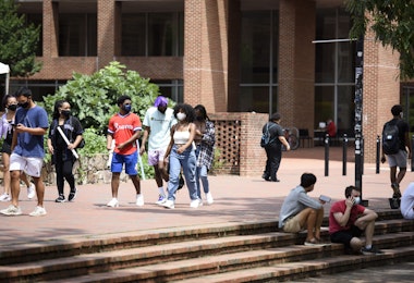 CHAPEL HILL, NC - AUGUST 18: Students walk through the campus of the University of North Carolina at Chapel Hill on August 18, 2020 in Chapel Hill, North Carolina.The school halted in-person classes and reverted back to online courses after a rise in the number of COVID-19 cases over the past week. (Photo by Melissa Sue Gerrits/Getty Images)