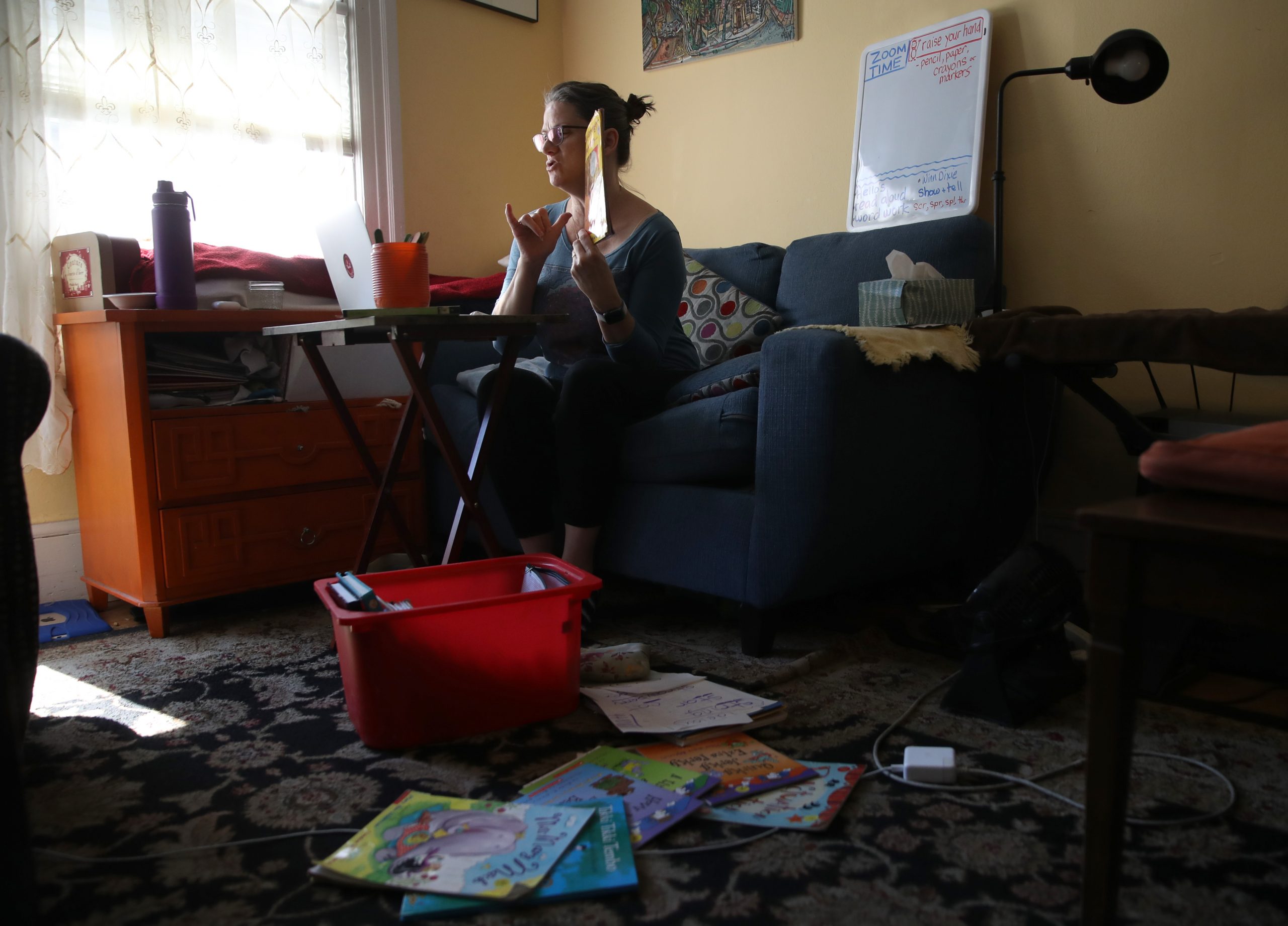 SAN FRANCISCO, CALIFORNIA  - MARCH 20: Leanne Francis, first grade teacher at Harvey Milk Civil Rights Academy, conducts an online class from her living room on March 20, 2020 in San Francisco, California. With schools closed across the United States due to the COVID19 pandemic, teachers are holding some classes for students online. (Photo by Justin Sullivan/Getty Images)