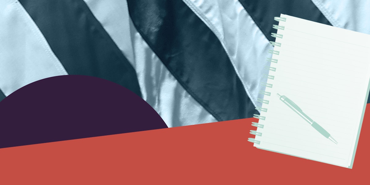 A notebook in front of a green and white flag