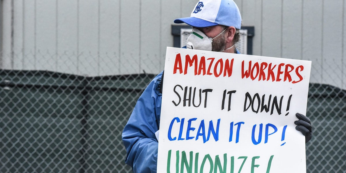 NEW YORK, NY - MAY 01: People protest working conditions outside of an Amazon warehouse fulfillment center on May 1, 2020 in the Staten Island borough of New York City. People attending the protest are concerned about Amazon's handling of the coronavirus and are demanding more safety precautions during the pandemic. (Photo by Stephanie Keith/Getty Images)