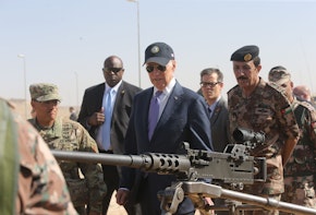 ZARQA, JORDAN - MARCH 10: U.S Vice President Joe Biden (C) reviews weapons and troops during a visit with Jordan's King Abdullah (not pictured) at a joint Jordanian-American training center on March 10, 2016 in Zarqa northeast of Amman, Jordan. This is the final stop on Biden's Middle East tour that also took in Israel and the Palestinian territories. (Photo by Jordan Pix/Getty Images)
