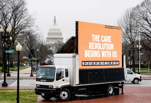 WASHINGTON, DC - MARCH 25: An LED display calling on Congress to invest in Care jobs sits in front of Union Station on March 25, 2021 in Washington, DC. Members of the Service Employees International Union (SEIU) and National Domestic Workers Alliance (NDWA) project a pledge demanding that Congress prioritize caregiving in the next recovery package in an installation outside of the US Capitol. The pledge was signed by 17,574 caregivers, consumers and family members. (Photo by Jemal Countess/Getty Images for National Domestic Workers Alliance & Service Employees International Union )